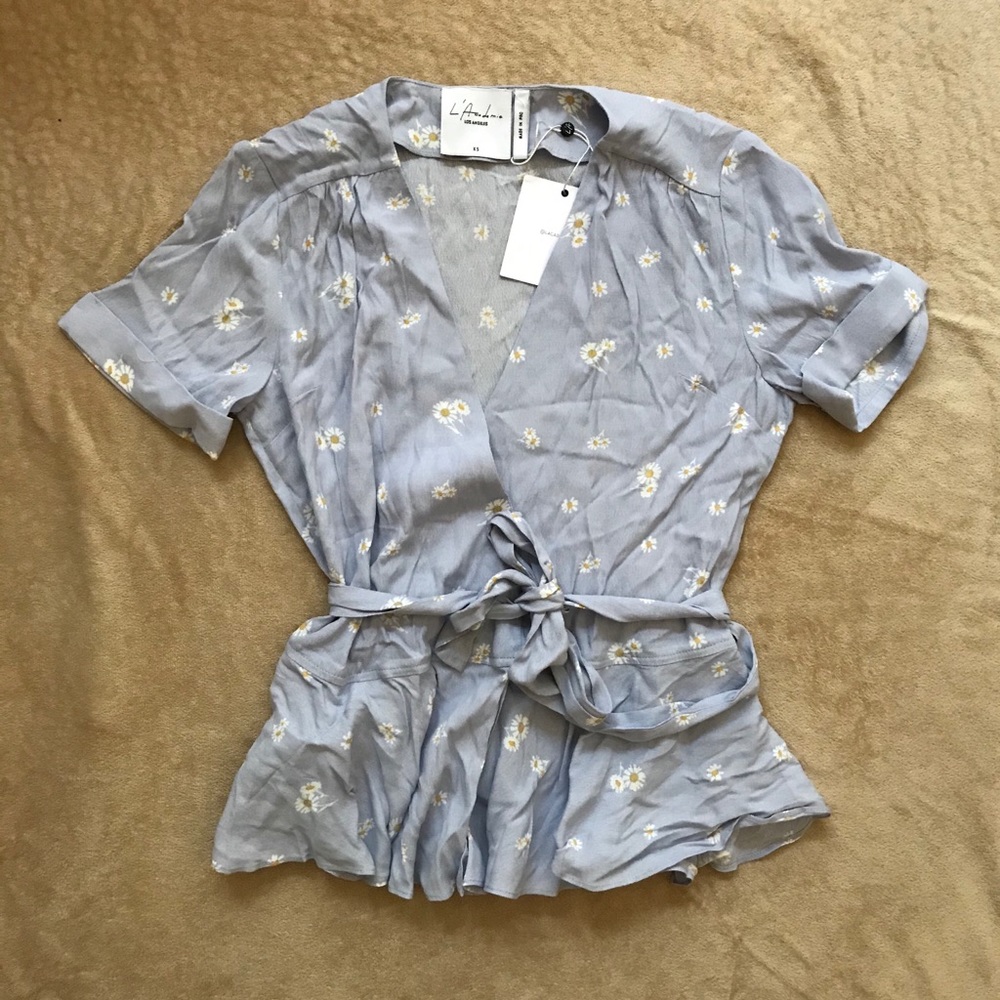 L’Acadmie REVOLVE short sleeve wrap top daisy
